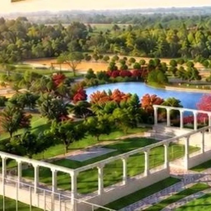Prestige Chapparakallu Road water body ringed by flowering trees in the launch render